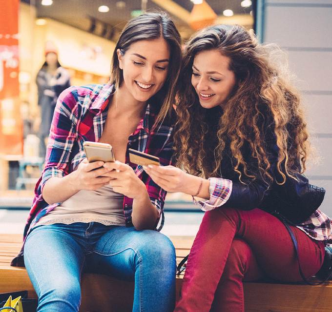 Friends paying online with debit card